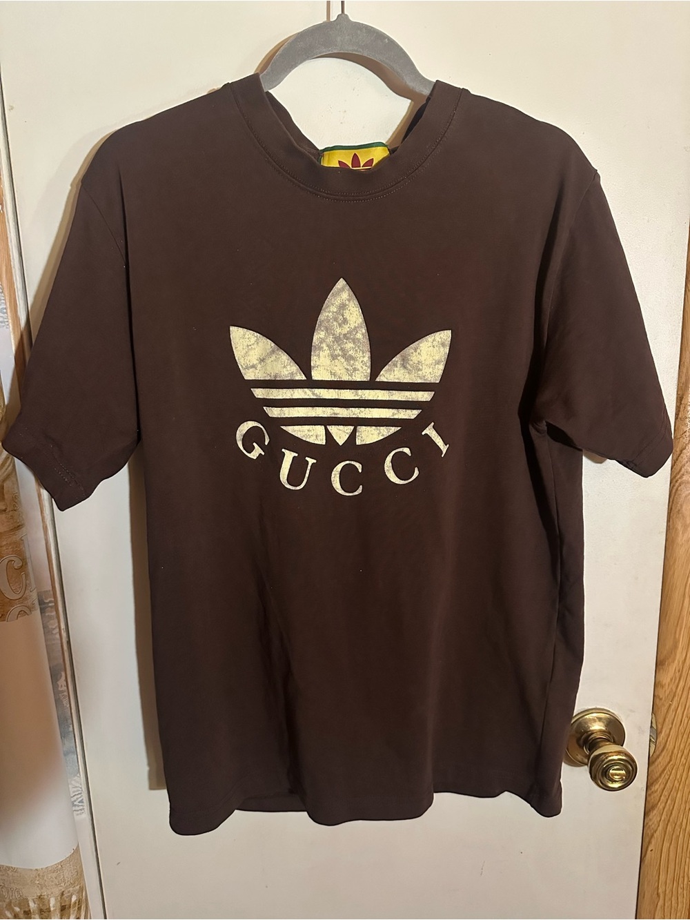Gucci Brown Tee with Distressed Gold Logo